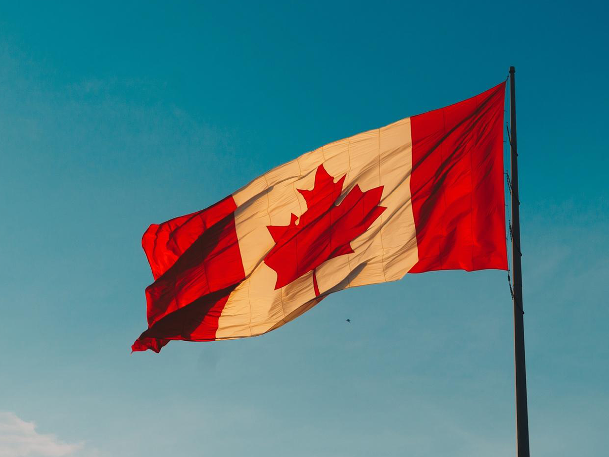 Canadian Flag against a blue sky