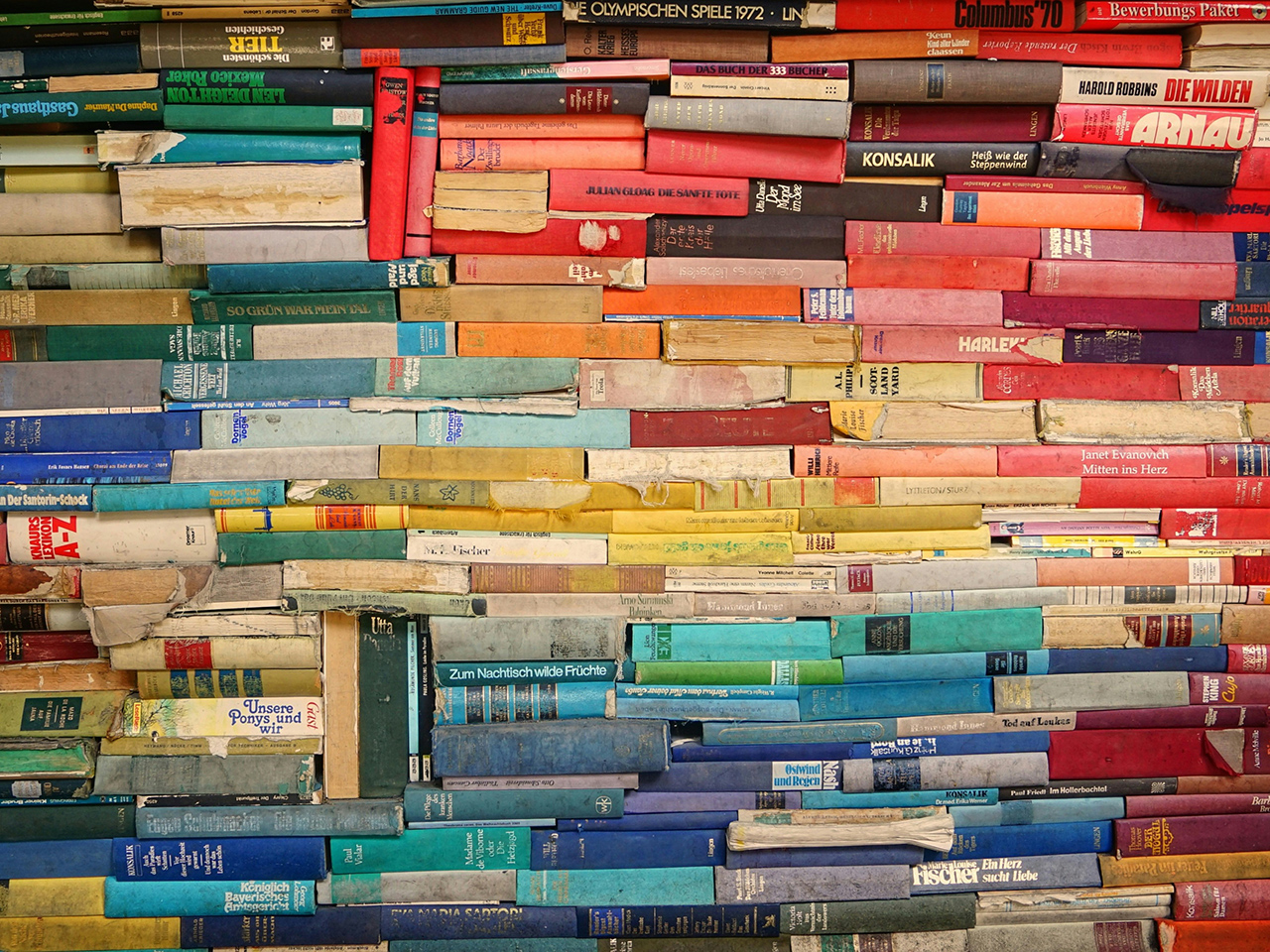 An artist’s rendering of the author’s pile of unread books.