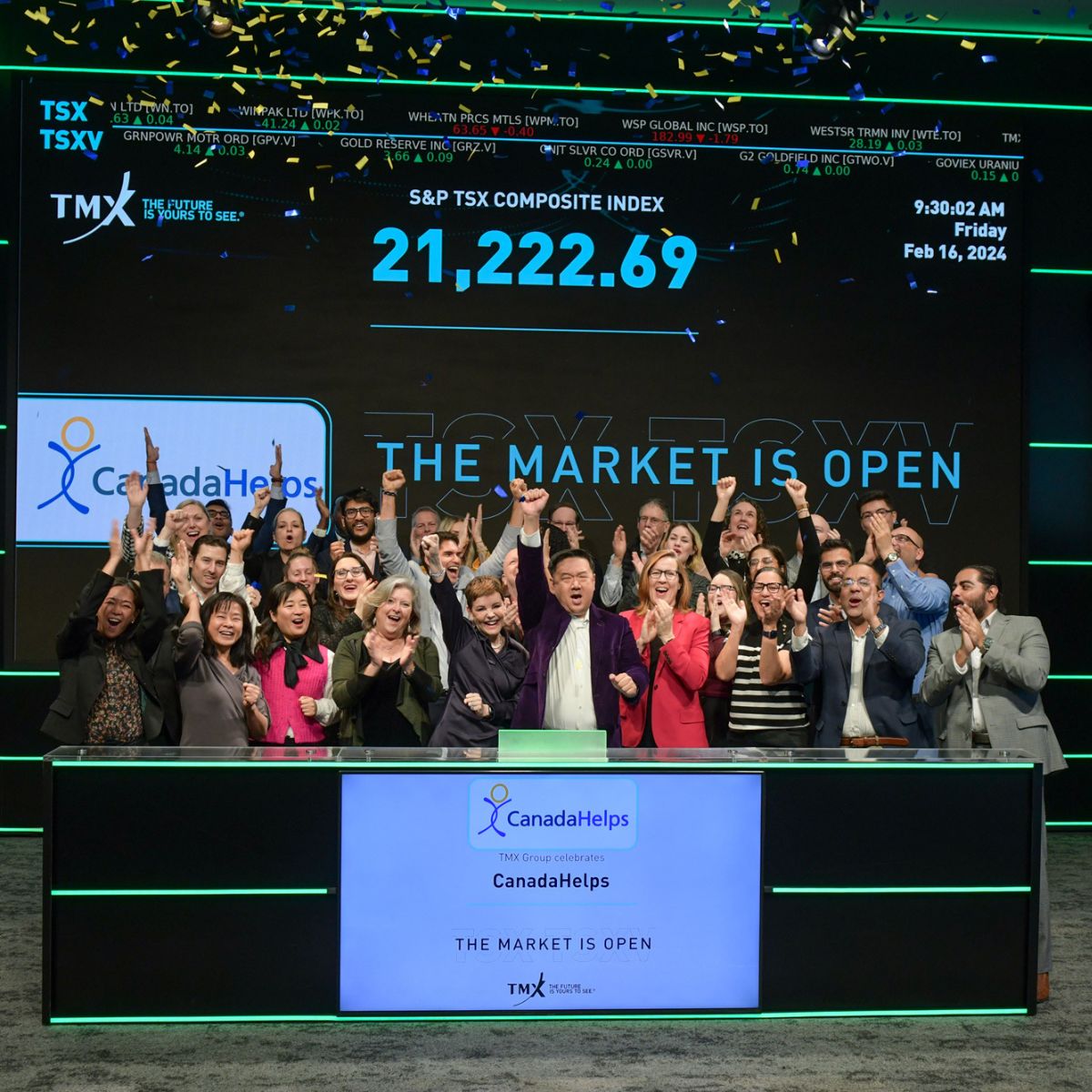 CanadaHelps CEO Duke Chang (centre) and his team open the Toronto Stock Exchange on Friday, Feb. 16 to celebrate having surpassed $3 billion in donations on the charity’s online giving platform.