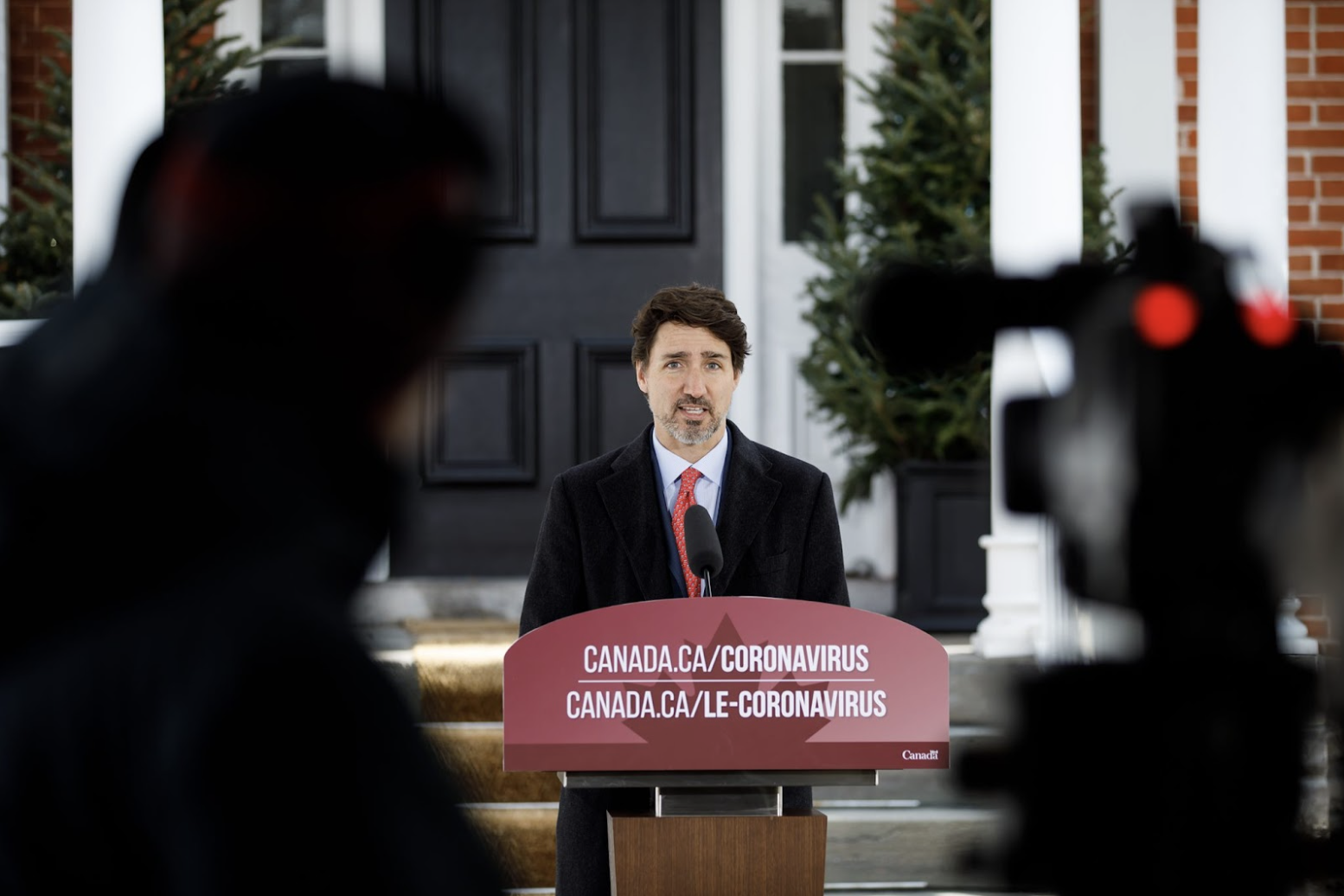 Canada's Prime Minister Justin Trudeau stand at a podium.