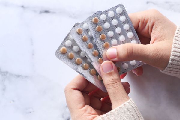 A person holds birth control pills. While the Canadian government has announced a deal for access to free contraception, advocates say there are other barriers to address. (Towfiqu Barbhuiya/Canva)