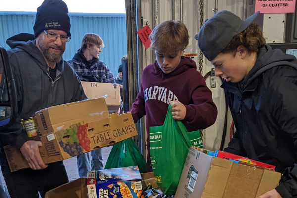 Volunteers help pack food at the Red Deer Food Bank. (Submitted/Red Deer Food Bank)