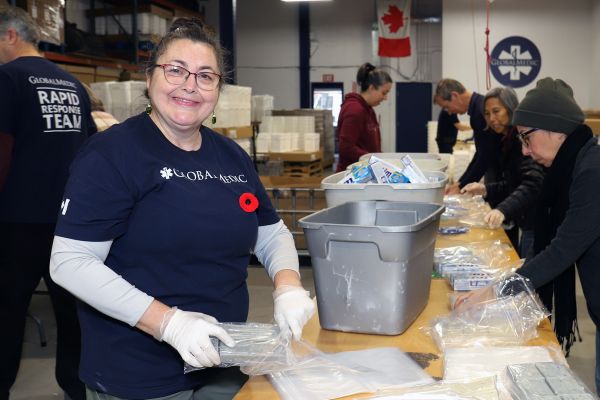 Volunteers pack kits at Global Medic in Etobicoke.