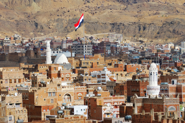 A flag flies in Sanaa, Yemen, inhabited for more than 2,500 years. The OId City of Sanaa is a UNESCO World Heritage City but has been destroyed by civil war.