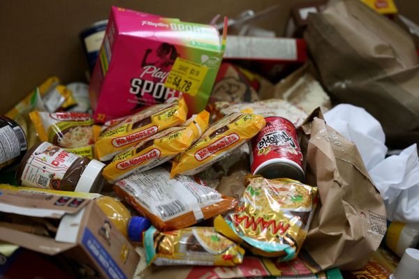 Volunteers sort donations at Harvest Manitoba, which distrubutes food to more than 380 community organizations including foodbanks, in Winnipeg on May 29, 2025. Photo: Shannon VanRaes