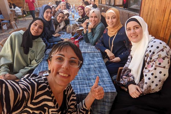 Manara is looking for 200 companies to commit to hiring Palestinian technology talent by the end of June 2024. Above is co-founder Iliana Montauk with Manara’s Gazan community. (Manara/Supplied photo)