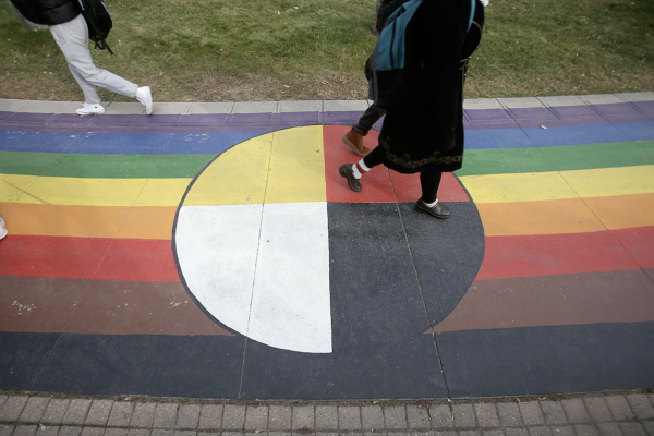 A medicine wheel is painted on a walkway at the University of Winnipeg. (Shannon VanRaes/Future of Good)