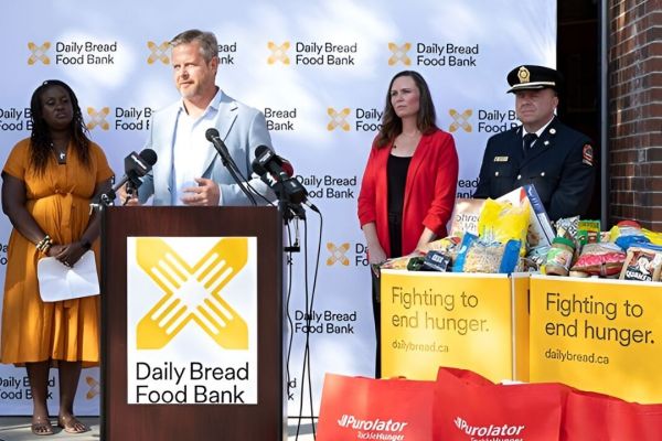 Daily Bread Food Bank CEO Neil Hetherington speaks to media in October of 2024 at a food drive, where he said the group had seen a 25 per cent increase in client use at the time, and was spending nearly $30 million annually on food - up from $1.5 million pre-pandemic. (Daily Bread/Supplied)