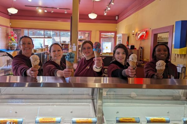 Long-time employee Leanne Smith, second from the left, stayed after a non-profit purchased Coombs Candy Store. She is now the manager of the store. (Supplied)