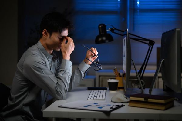 Managers and professionals were most likely to report having to work for free to keep up with job demands, according to Statistics Canada. (Canva/Supplied)